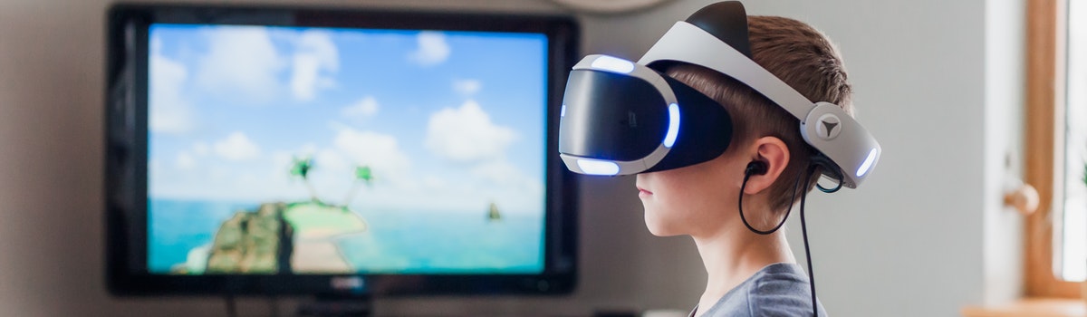 Boy using virtual reality goggles