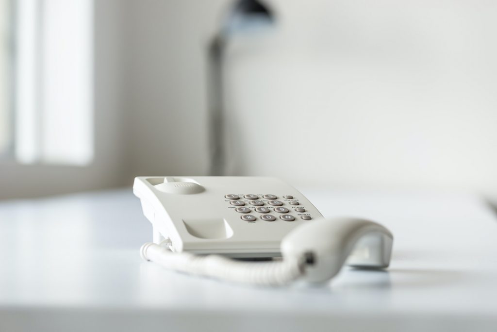 White landline telephone with handset off line